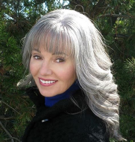 A popular option among women over 50 is also blending gray hair with highlights and lowlights. beautiful long GRAY HAIR STYLE pictures - WEHOTFLASH