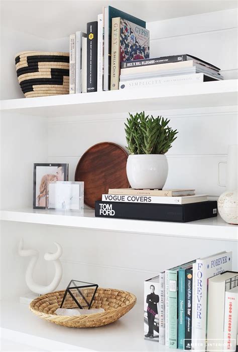 With decoration and home accessories like candles, wall art, plants, clocks, mirrors and more, your house says who you are and what you love. Remodelaholic | Styling Secrets: Decorating Shelves