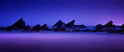 Download Wallpaper 2560x1080 Purple Sky Sunset Rocks Coast Beach