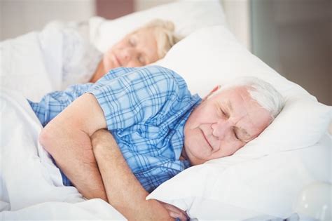 Premium Photo Senior Couple Sleeping On Bed