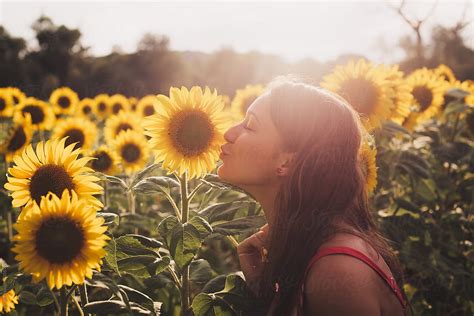 Beautiful Portrait Of A Girl Kissing A Sunflower By Stocksy Contributor Paff Stocksy