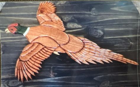 An Image Of A Bird Made Out Of Wood