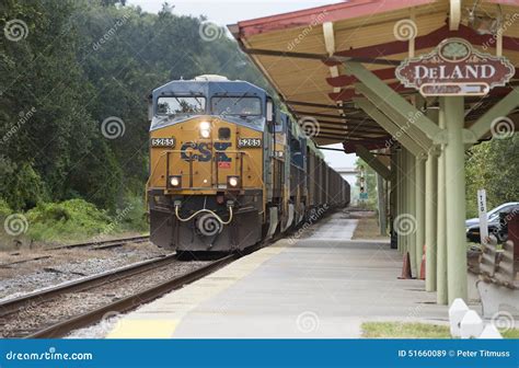 Freight Train Passing Through A Station Editorial Stock Image Image