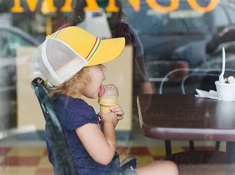 Little Girl Eating An Ice Cream Cone By Meaghan Curry Stocksy United