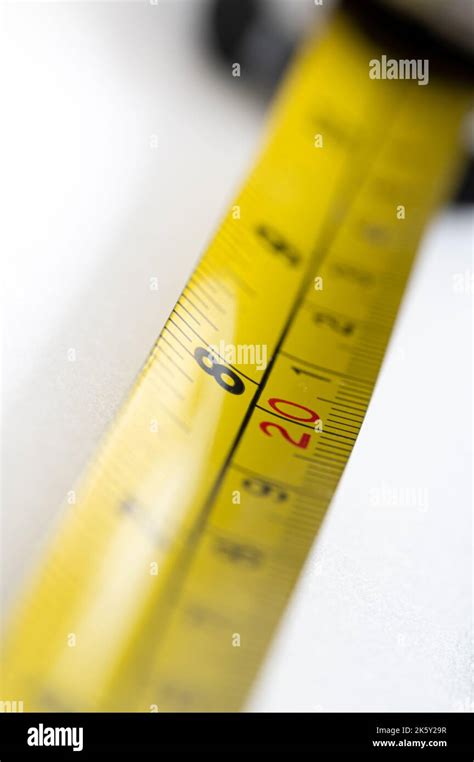 Yellow Tape Measure Showing 8 Inches And 20 Centimeters Stock Photo Alamy