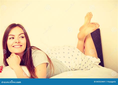 cheerful girl rolling in bed stock image image of couch bedding 84352469