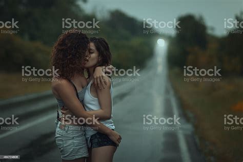 Girls Lesbians Kissing Under The Heavy Rain Stock Photo Download