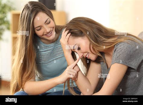 Girl Trying To Comfort And Making Laugh To Her Sad Best Friend After A