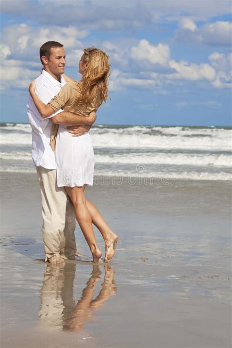 Man And Woman Couple Having Fun On A Beach Stock Image Image Of Twenties Clouds 12941007