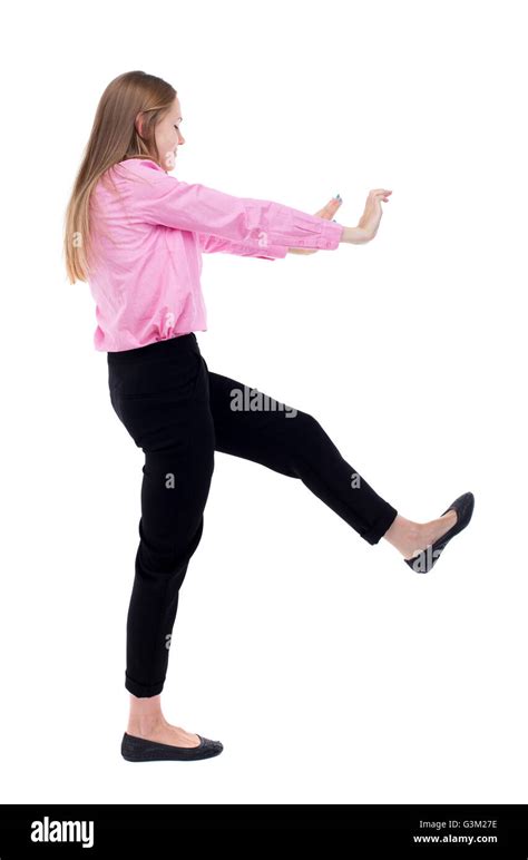 Back View Of Business Woman Pushes Wall Isolated Over White Background