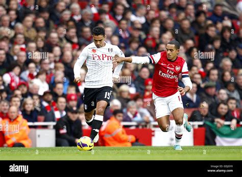 Arsenals Theo Walcott Right And Fulhams Kieran Richardson Left