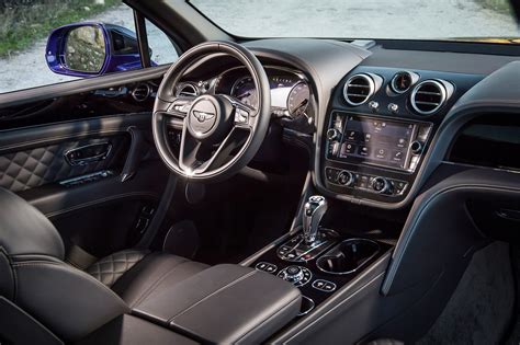 Car dashboard, modern luxury interior, steering wheel. Top 10 Best Car Interiors of 2017: WardsAuto » AutoGuide ...