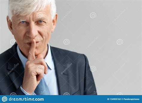 Business Lifestyle Businessman Standing On Gray Showing Secret Gesture