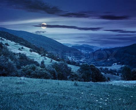 Village On Hillside Meadow At Night Stock Image Colourbox