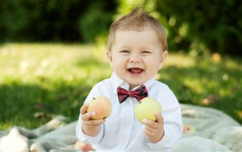 Smiley Baby Holding Apple Wallpapers