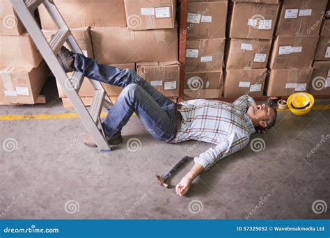 Worker Lying On The Floor In Warehouse Stock Photo Image Of Length