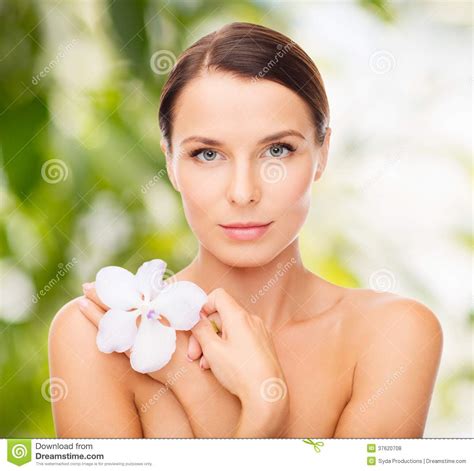 Relaxed Woman With Orchid Flower Stock Photo - Image of cosmetics, floral: 37620708