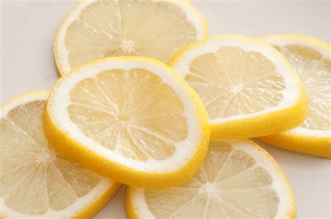 Heap Of Fresh Lemon Slices On White Free Stock Image