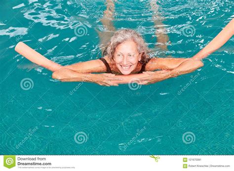 Senior In The Swimming Pool Is Doing Aqua Fitness Stock Image Image