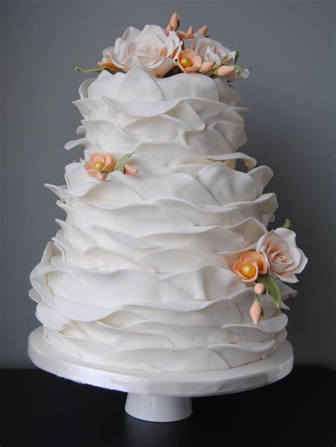 Ruffled Wedding Cake With Pale Peach Sugar Roses And Blossoms From The