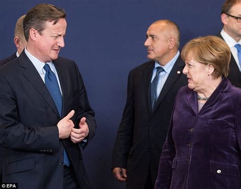 David Cameron And Angela Merkel Grimace At Eu Summit In Brussels