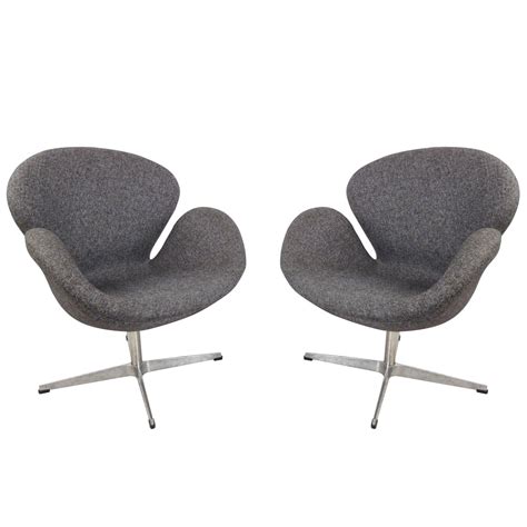 This lounge chair set is the focal point of any outdoor space with comfortable cushions, midcentury curves, and modern disposition. Pair of Mid-Century Modern Arne Jacobsen Style Swivel Lounge Chairs For Sale at 1stdibs