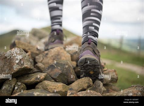 Close Up Of Legs Of Woman Hiker Walking On The Mountain Trail Focus On