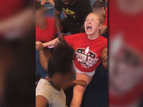 Disturbing Videos Show High School Cheerleaders Forced Into Splits