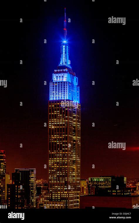 New York Citys Empire State Building At Night With Blue Lights Stock