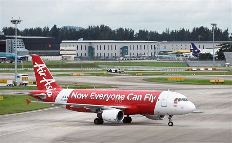 Fly with airasia, feel asia. Frantic search for AirAsia flight missing after bad ...