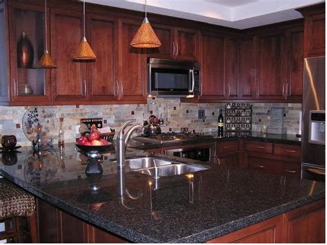 Kitchen glass tiles backsplash, cherry cabinets and granite countertops. Hmm...maybe a little too dark | Backsplash with dark ...