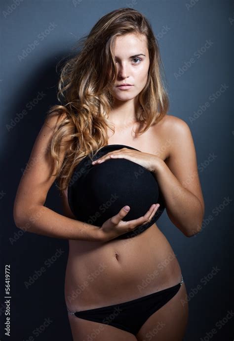Naked Woman Covering Breasts With Hat Stock Photo Adobe Stock