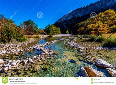 Bright Beautiful Fall Foliage On The Crystal Clear Frio River In Texas