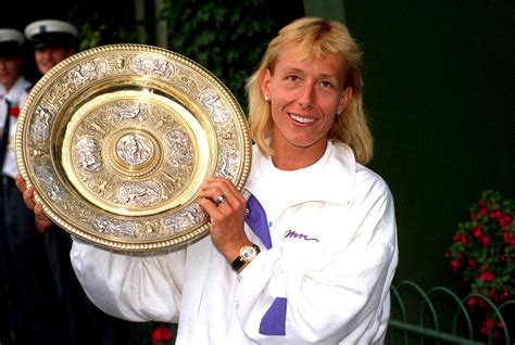 Martina Navratilova celebrates with the Ladies' Singles trophy after winning the title for the ...