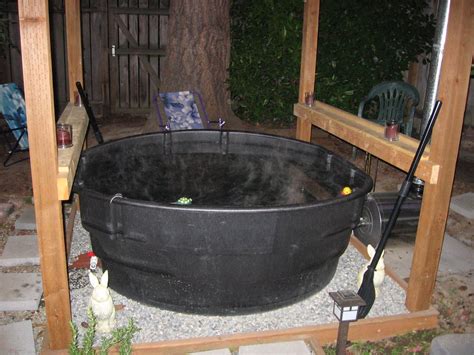 Bathing in wood is luxurious and greener than using modern materials. A wood fired stock tank hot tub | Alternative Energy ...
