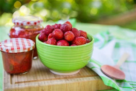 Homemade Strawberry Jam In Different Jars And Fresh Ripe Strawberries