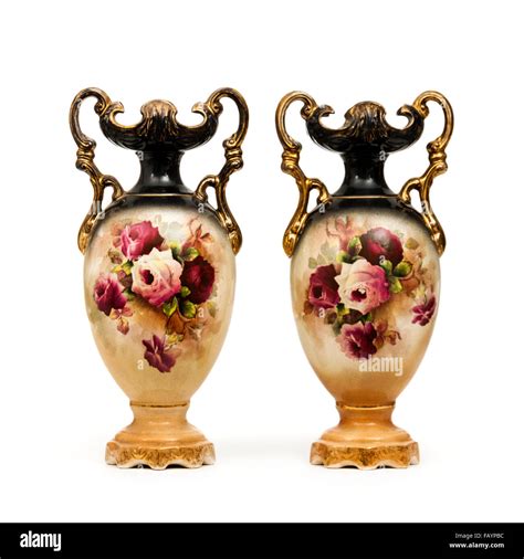 Pair Of Antique Ceramic Vases With Gilded Handles And Floral Hand