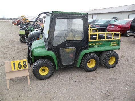 Features a huge working dump bed with a tailgate than opens up. John Deere 6 wheel Gator w/cab