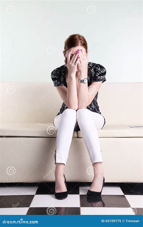 Young Woman Sitting With Hands Over Her Face Stock Image Image Of Female Bored 65159775