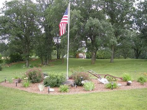 Since every flag pole is constructed differently, you'll need to follow the instructions specific to your product. Garden Path Elements | Flag pole landscaping, Backyard ...