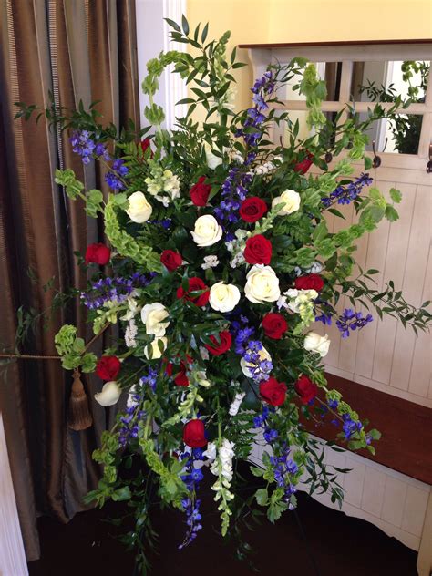 Here are thirteen popular funeral flower meanings to honor your loved one. Red white blue easel #sympathy #funeral #flowers # ...