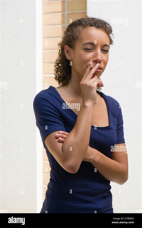 Young Woman Smoking Cigarette Stock Photo Alamy