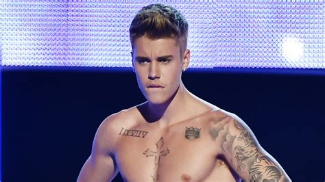 justin bieber s dad is proud of his son s package entertainment tonight