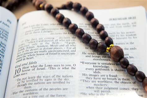 Wooden Rosary Between The Pages Of The Bible With The Psalm Stock Image