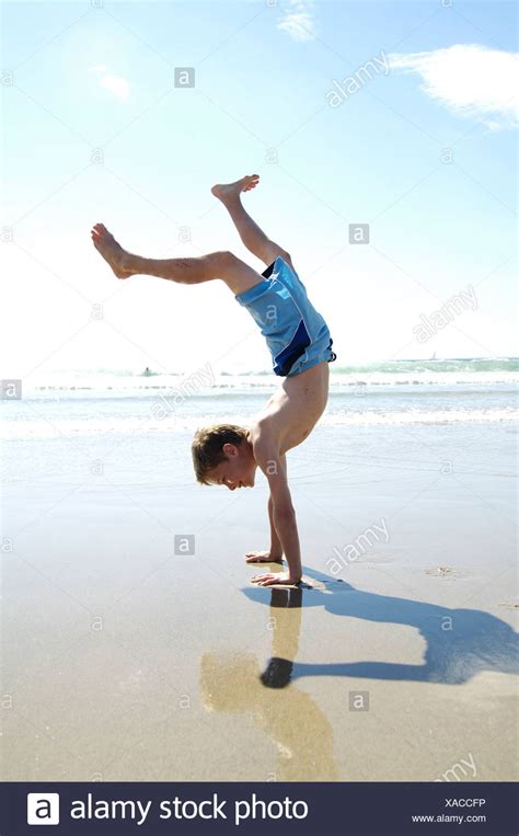 Side Profile Of Boy Doing Handstand On Beach Stock Photo 281785722 Alamy