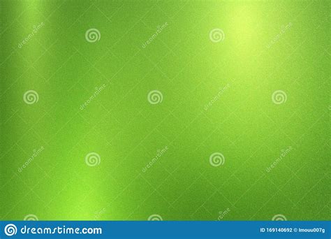 Green Foil Metallic Wall With Glowing Shiny Light Abstract Texture