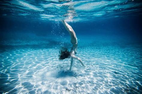 underwater view of woman swimming in ocean by gable denims on 500px