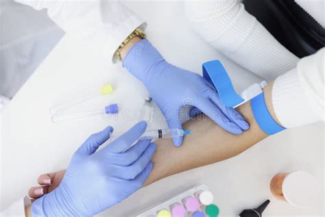 Nurse Injects Liquid Medication In Womans Vein With Needle Stock Image