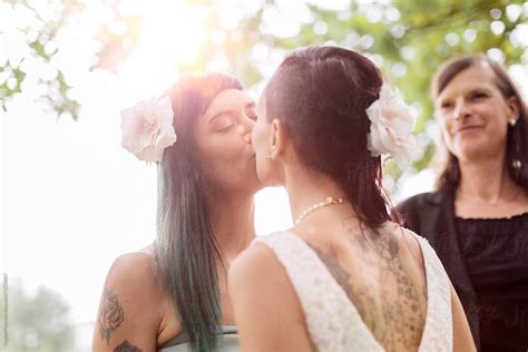 Lesbians Kissing After Being Married Del Colaborador De Stocksy VegterFoto Stocksy