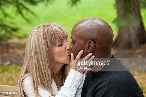 Interracial Couple Kissing In A Park Edmonton Alberta Canada High Res